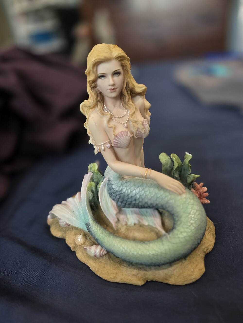 Enchanted Song Mermaid Sitting on the Ocean Floor" statue